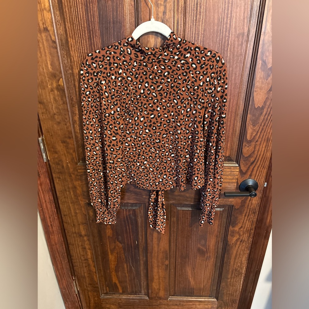 LUSH blouse rust color animal print size medium tie back high neck used